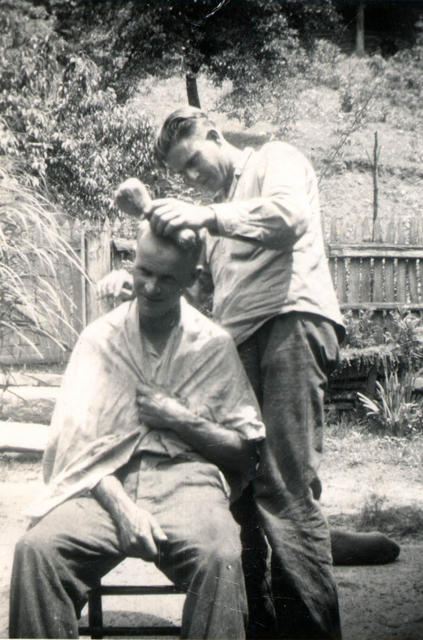 Tee cutting Os's hair